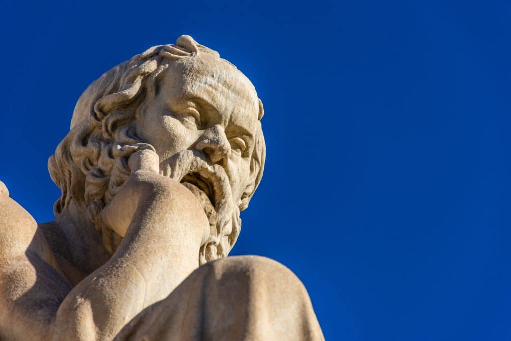 Statue of the Greek philosophers Socrates Plato in front of the Academy pf Athens Greece