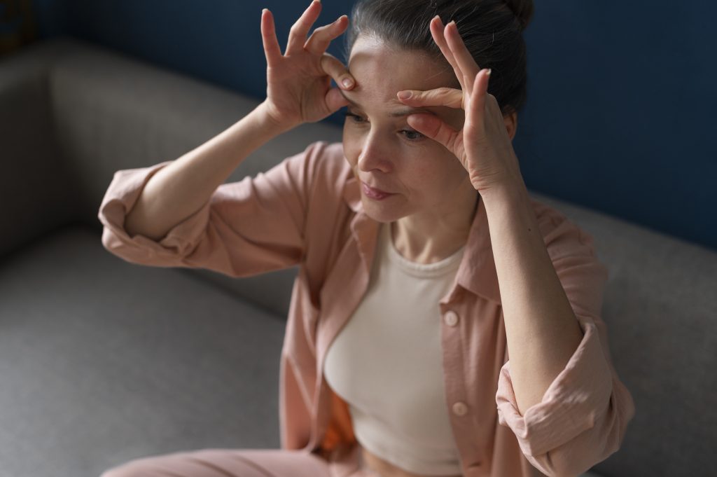 high angle woman practicing facial yoga