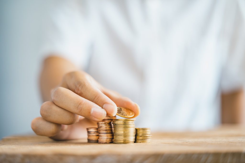 Gold coin Stack On the table save money Taking care of money