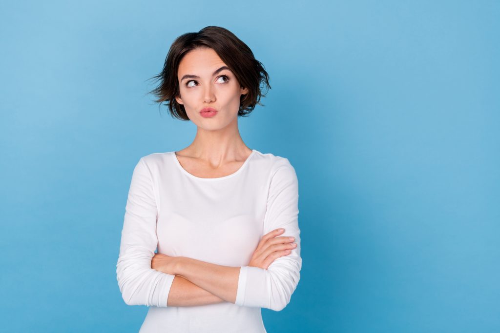 Photo of funky funny cool business woman look copyspace brainstorming idea plan isolated on blue color background